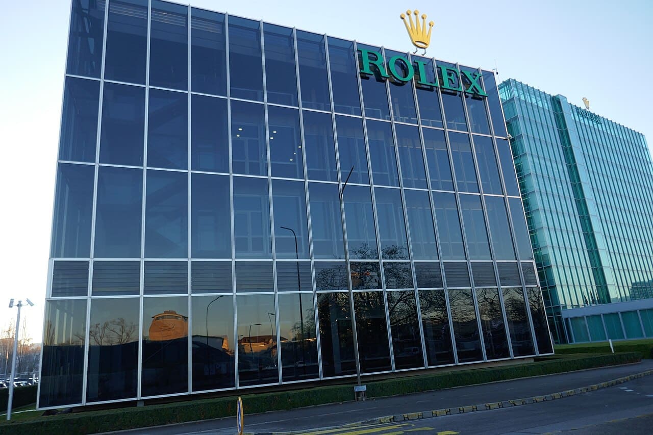 Window_reflections,_Rolex_headquarters,_Geneva-01 Photo by Carolyn Carolyn MHM55, via Wikimedia Commons